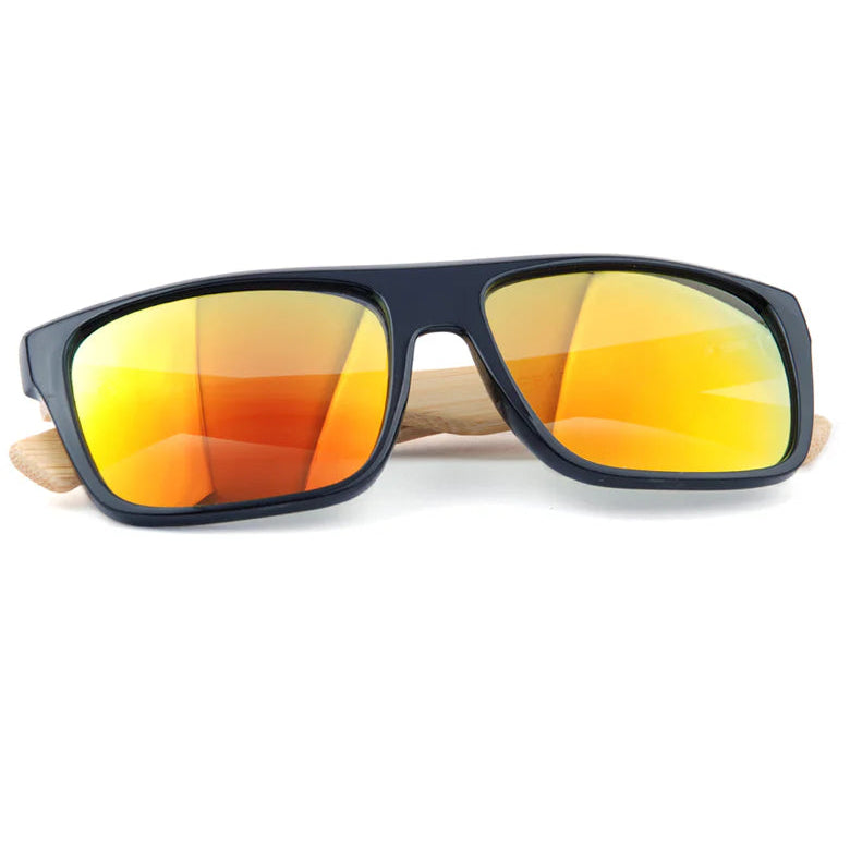 Sunglasses with black frame and orange-tinted lenses on a white background