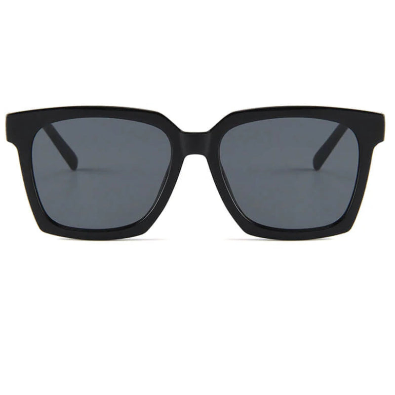 Black sunglasses with dark lenses on a white background