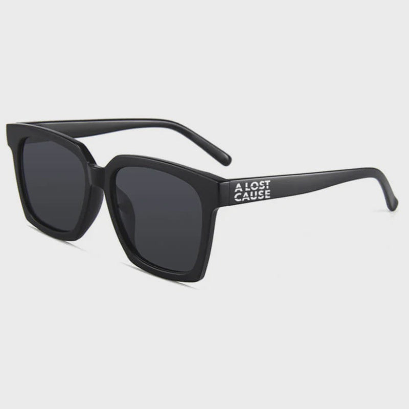 Black sunglasses with 'Lost Cause' branding on a white background