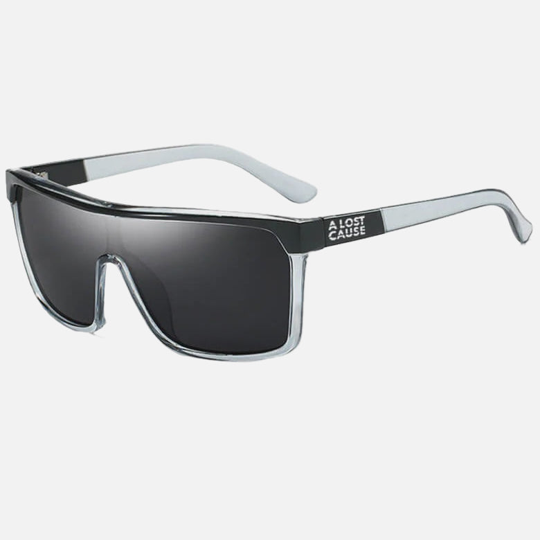 Sunglasses with a clear frame and black lenses on a white background