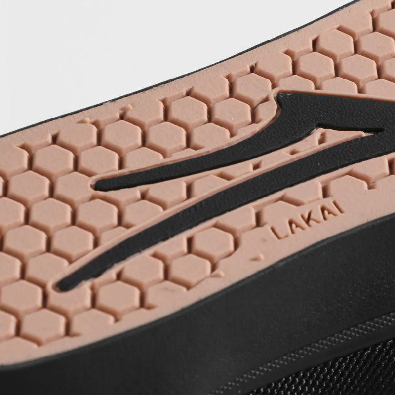 Close-up of a shoe sole with a textured pattern and 'Lakai' branding.