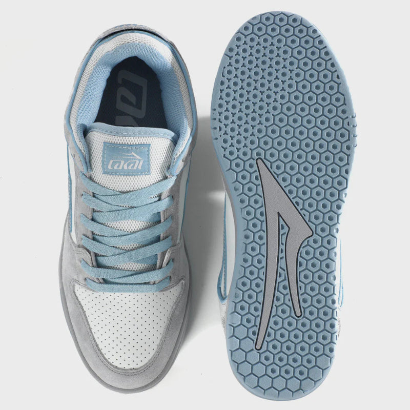 Light blue and white sneaker with a brand logo on a light gray background