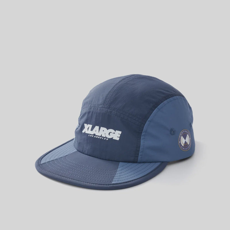 Navy blue cap with 'XLarge' logo on a light gray background