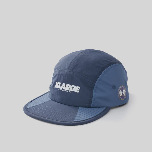 Navy blue cap with 'XLarge' logo on a light gray background