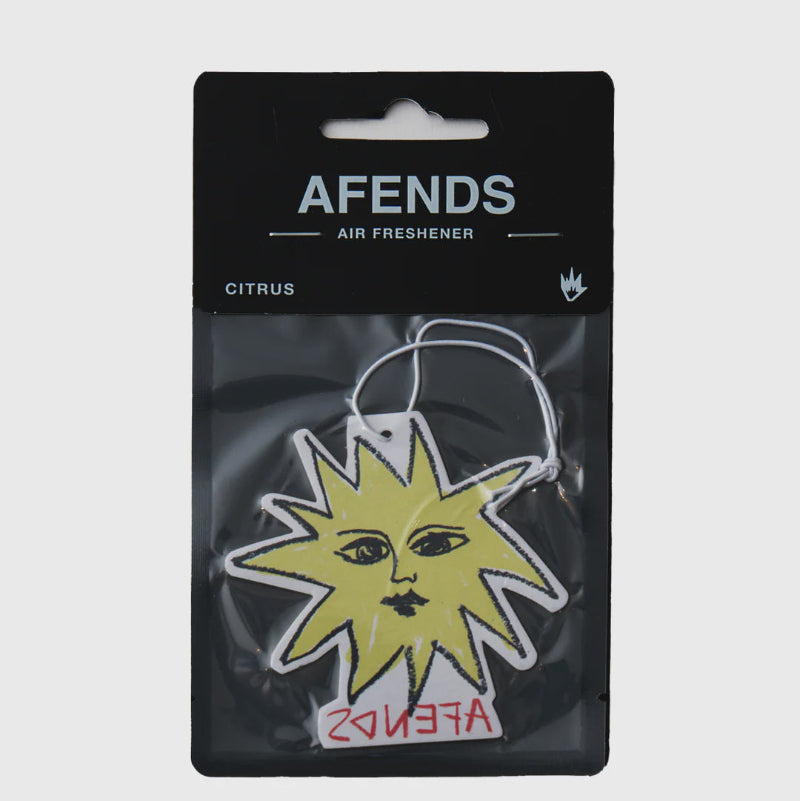 AFENDS air freshener packaging with a yellow sun design on a gray background