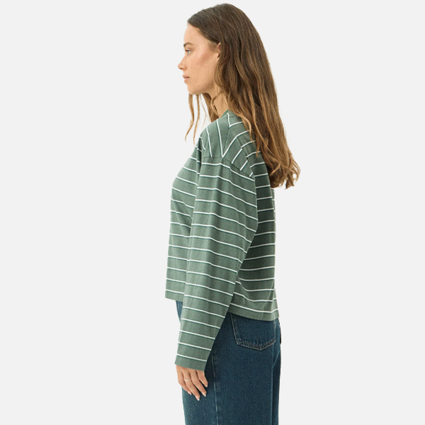 a women wearing a green t-shirt with white strips 