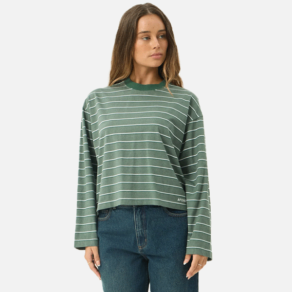 a women wearing a green t-shirt with white strips 