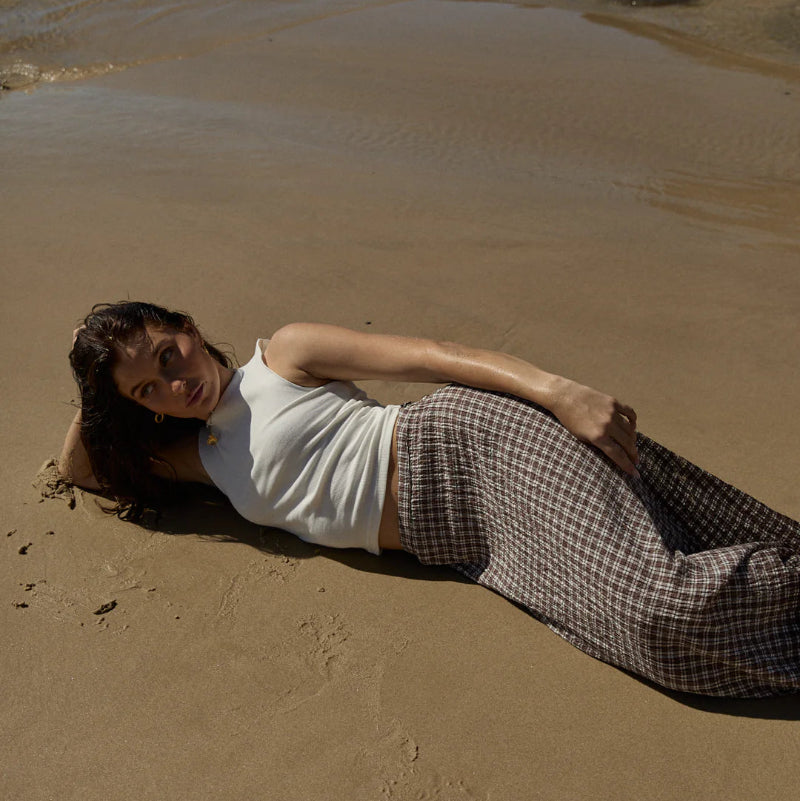 Person lying on a sandy beach