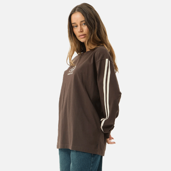 a women wearing a brown shirt with a white logo and white strips 