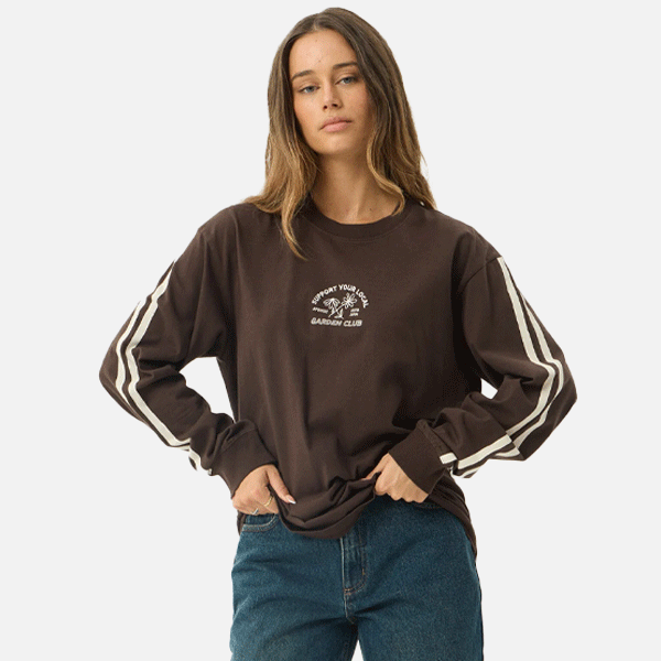 a women wearing a brown shirt with a white logo and white strips 