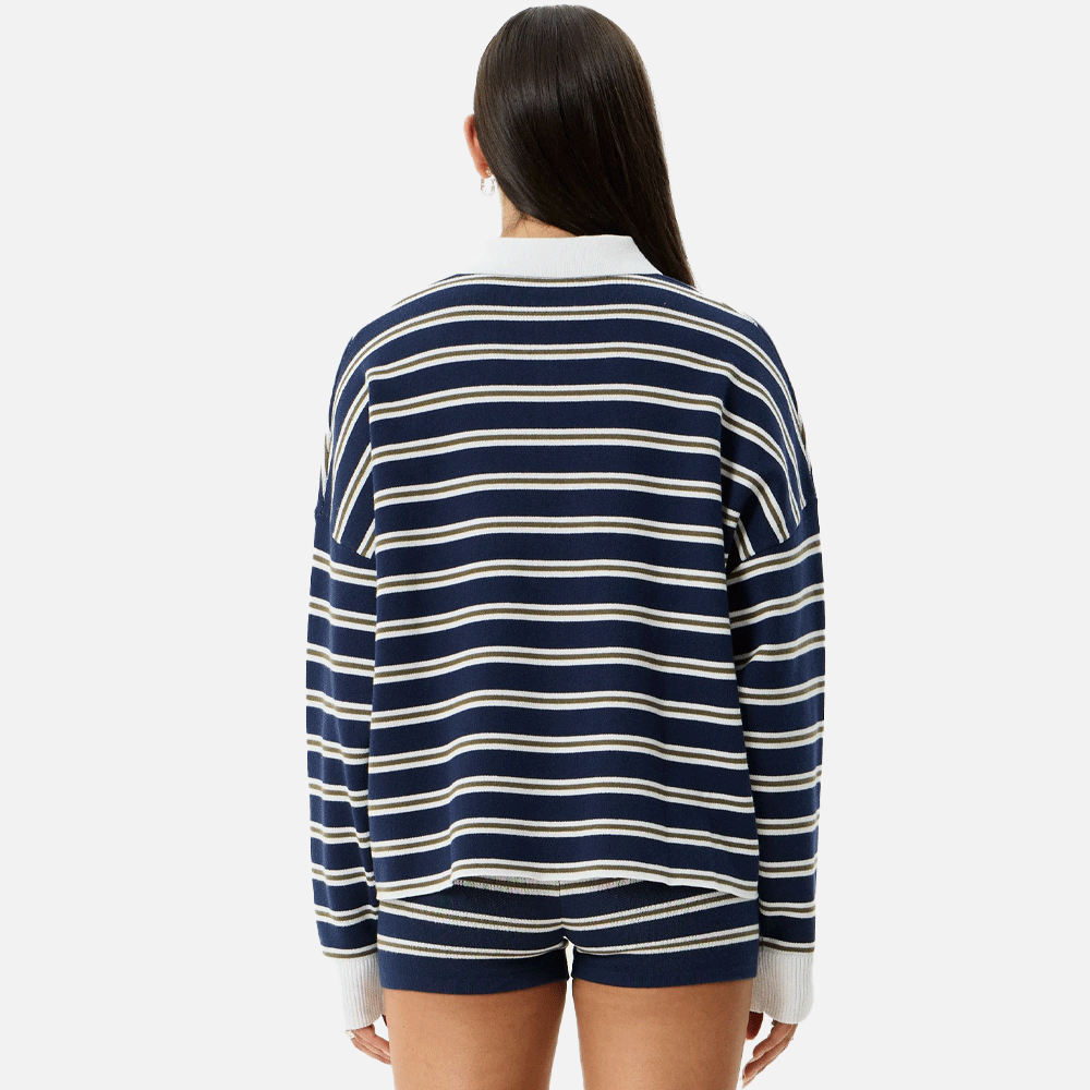 a women wearing a collared striped blue and white top