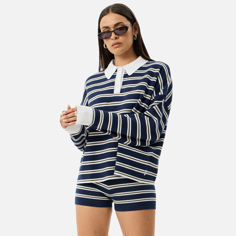 a women wearing a collared striped blue and white top