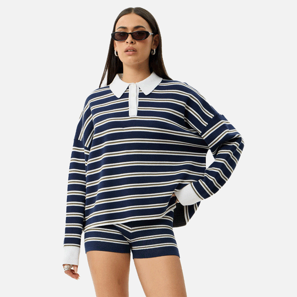 a women wearing a collared striped blue and white top