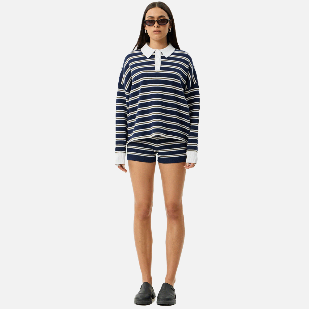 a women wearing a collared striped blue and white top