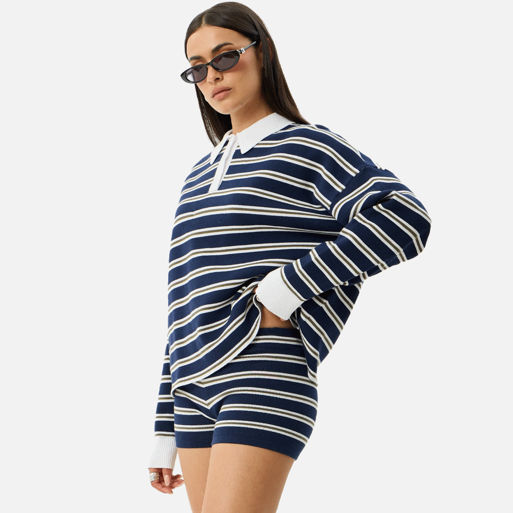a women wearing a collared striped blue and white top