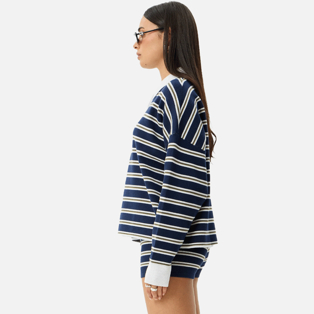 a women wearing a collared striped blue and white top