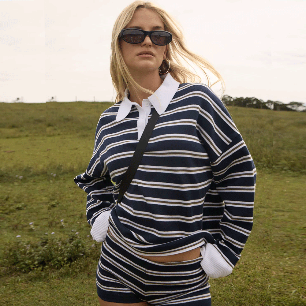 a women wearing a collared striped blue and white top