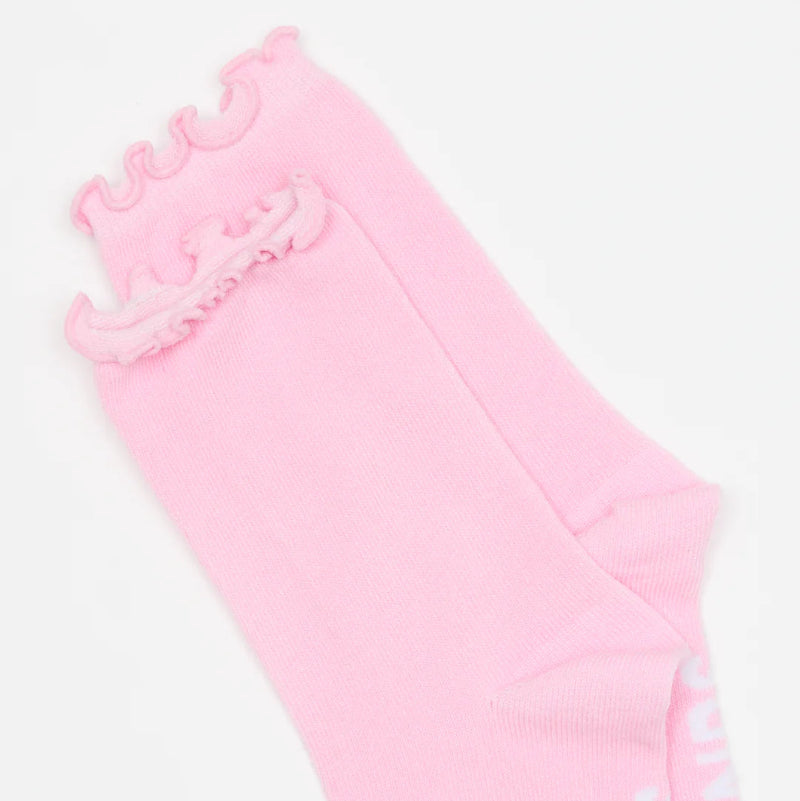 Pink sock with white text on a white background