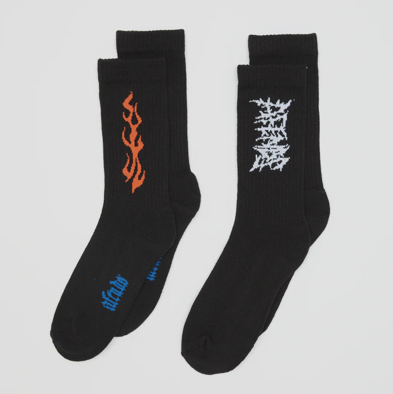 Two pairs of black socks with unique designs on a light gray background