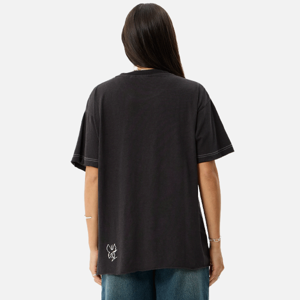 a wonen wereing a black t-shirt with a white logo with a white backround