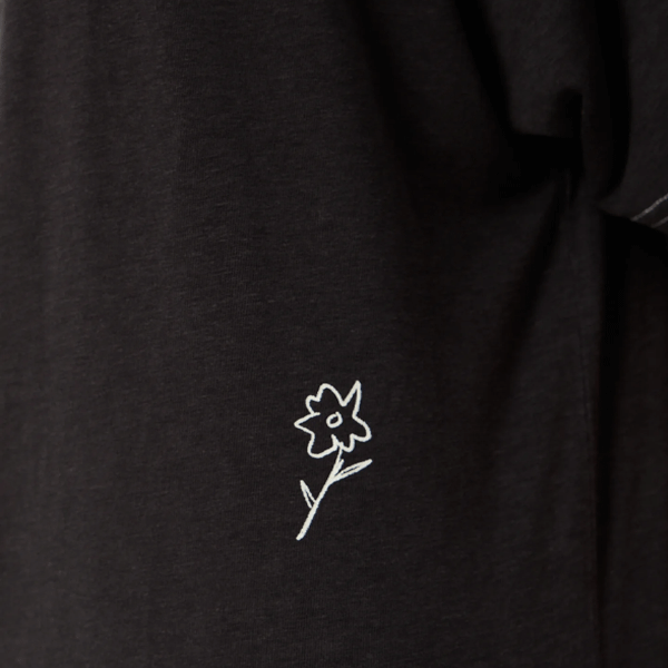 black t-shirt with small white flower print 