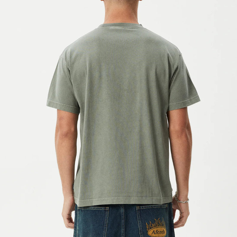 Man wearing a green t-shirt and blue jeans on a white background