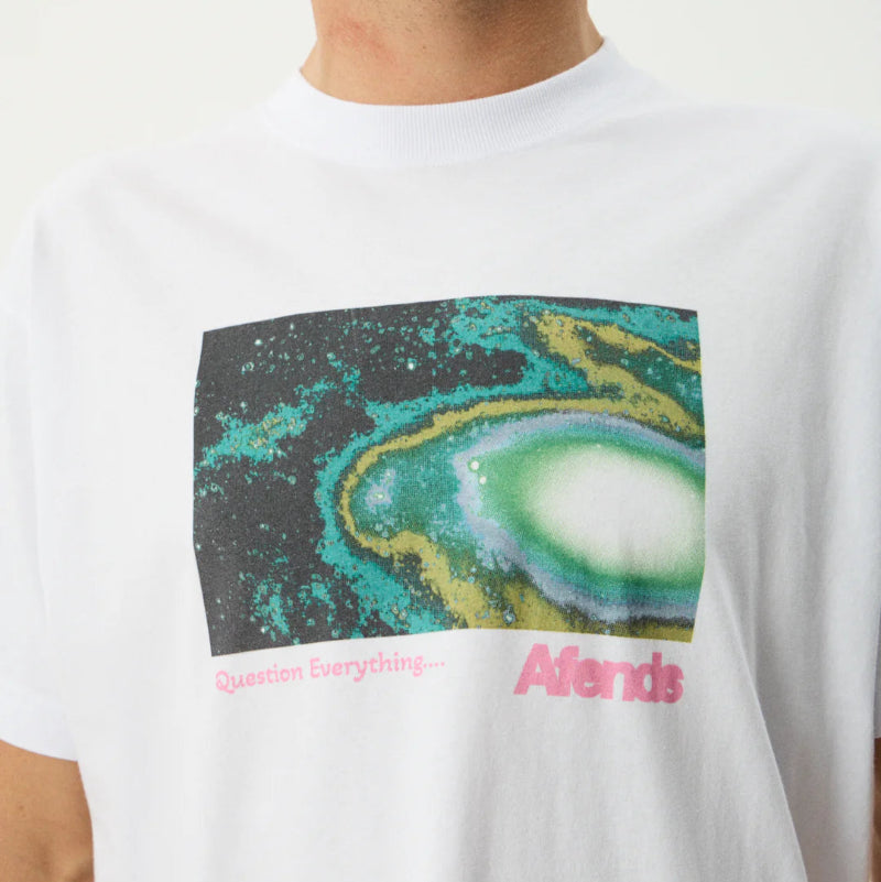 White t-shirt with a colorful graphic design and 'Adidas' branding.