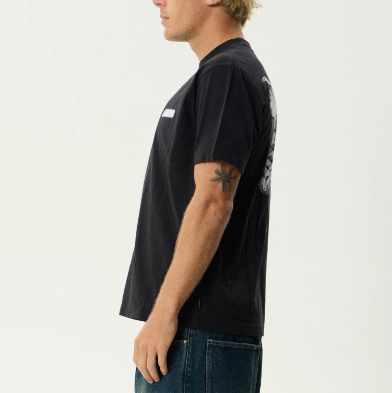 Person wearing a black t-shirt with a logo on a white background