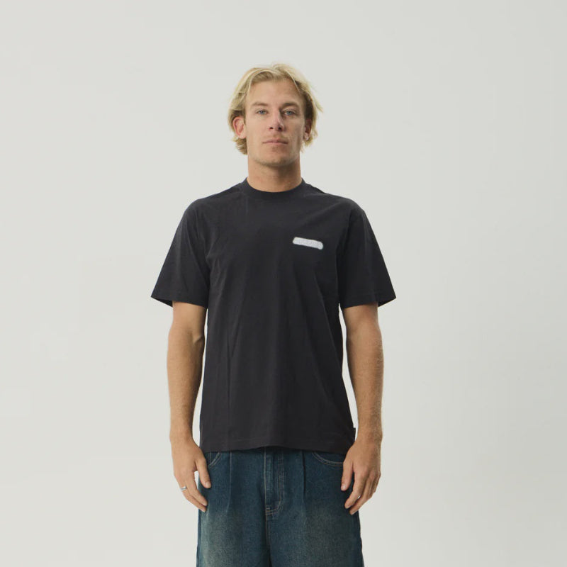 Person wearing a black t-shirt and denim shorts on a white background