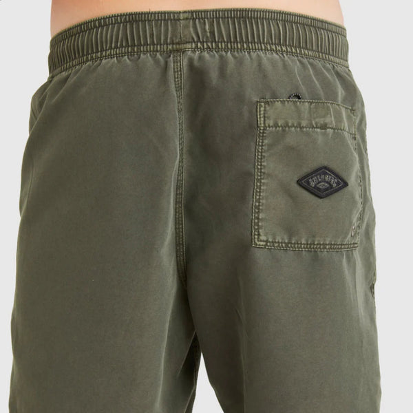 Green shorts with a brand logo on a white background