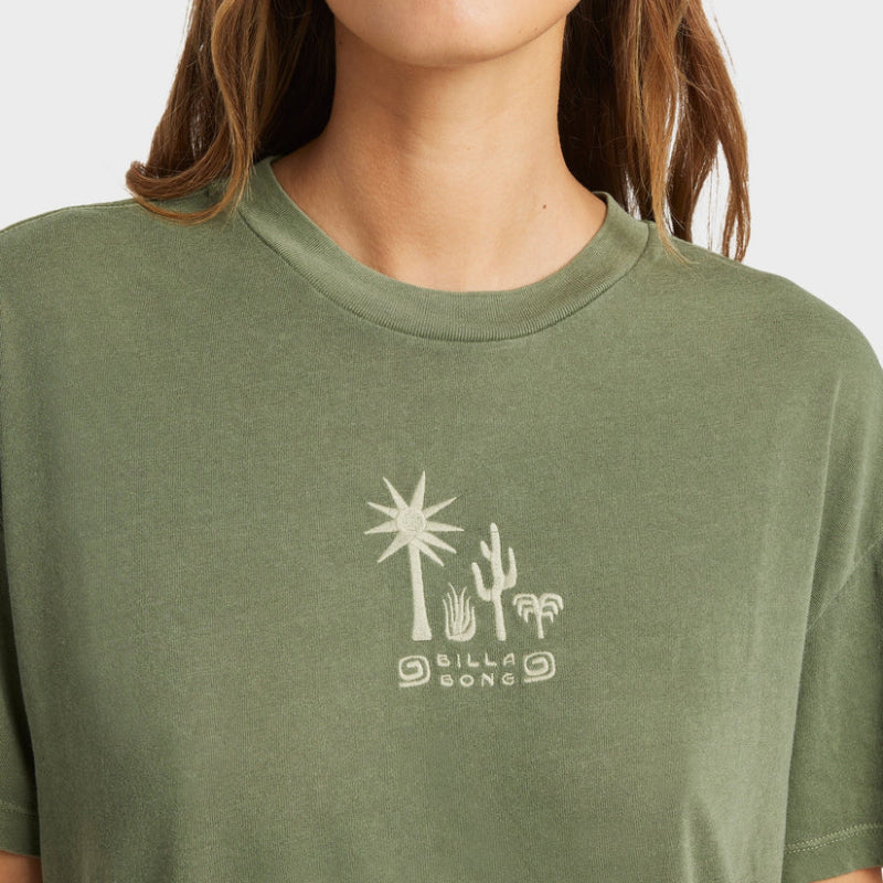 Green t-shirt with a palm tree and cactus design on a plain background