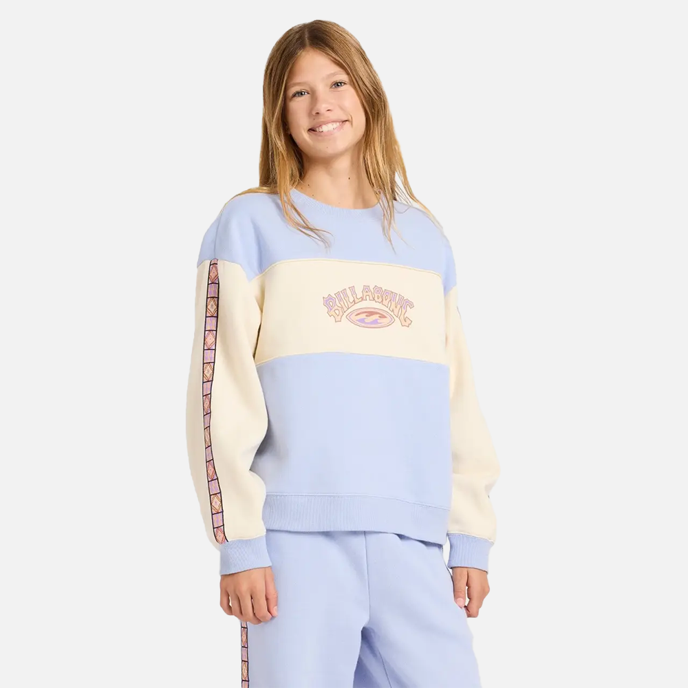 Person wearing a colorful sweatshirt with a visible brand logo on a white background