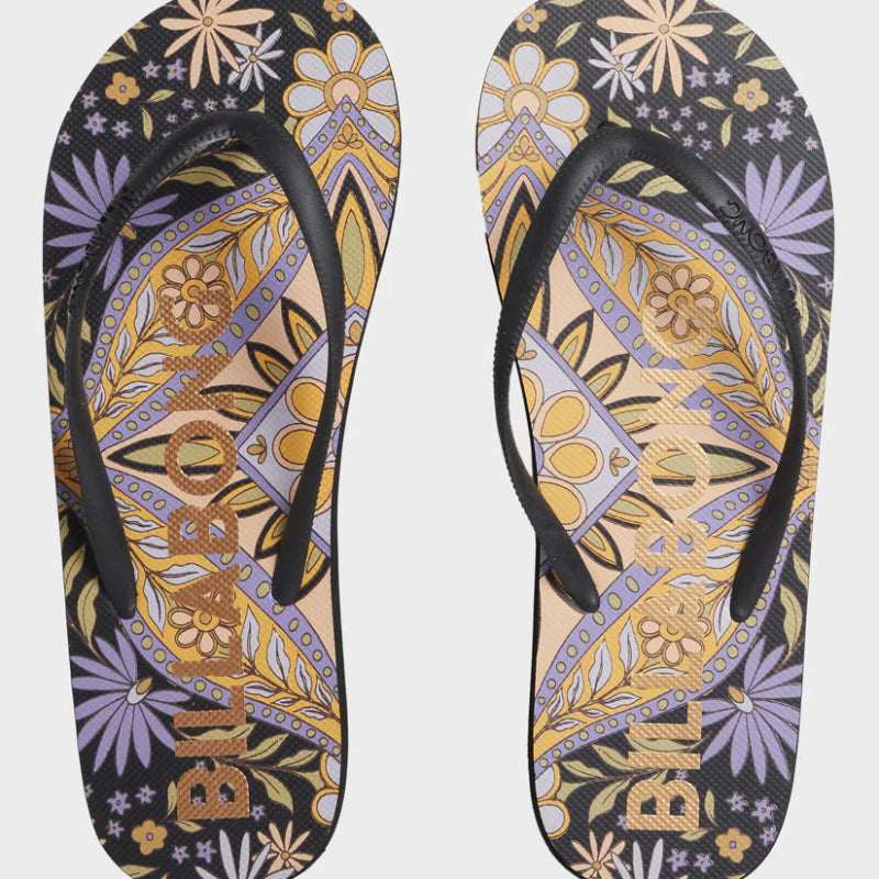 Pair of flip-flops with a colorful pattern on a white background