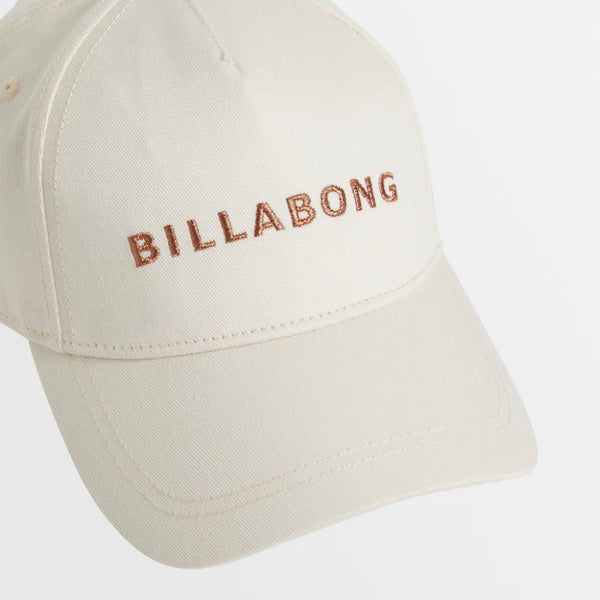 Beige cap with Billabong logo on a light gray background