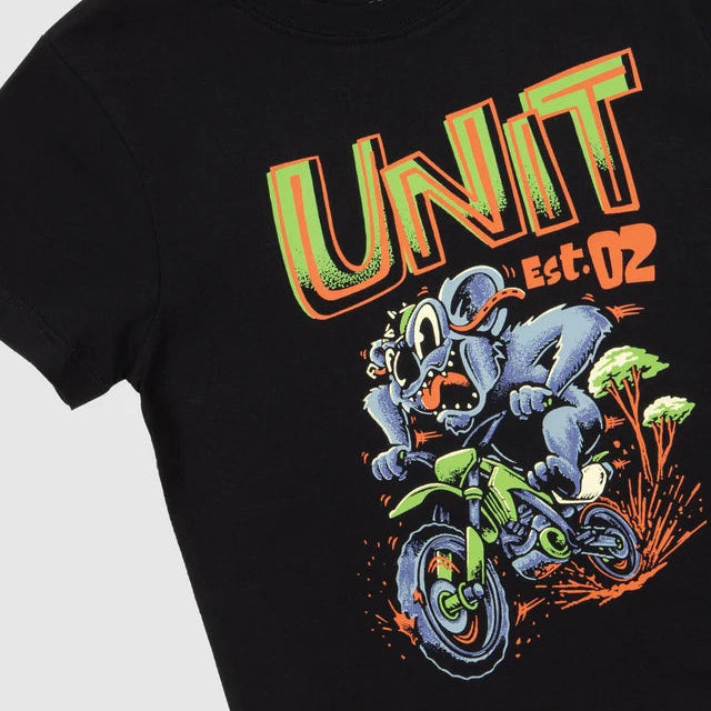 A close-up of a black short-sleeve t-shirt featuring a colorful graphic print of a cartoon character riding a green dirt bike under the text 'UNIT Est-02' in orange and green.
