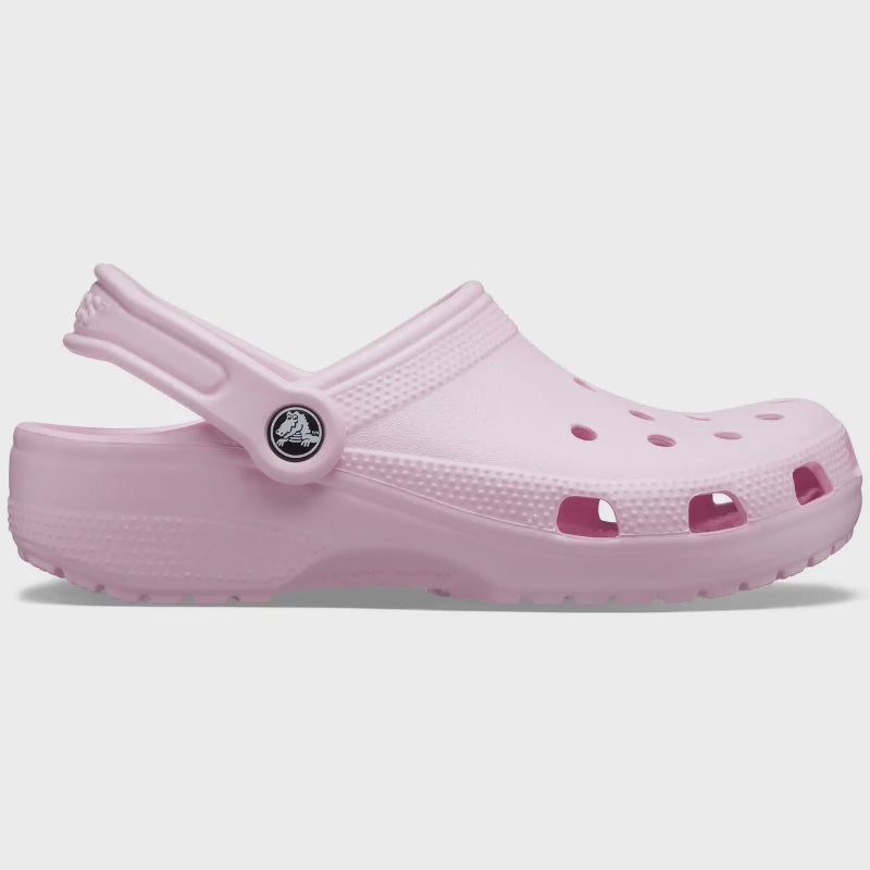 Pink clog shoe on a light gray background