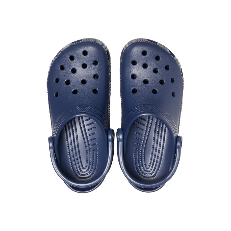 Pair of navy blue clogs on a white background