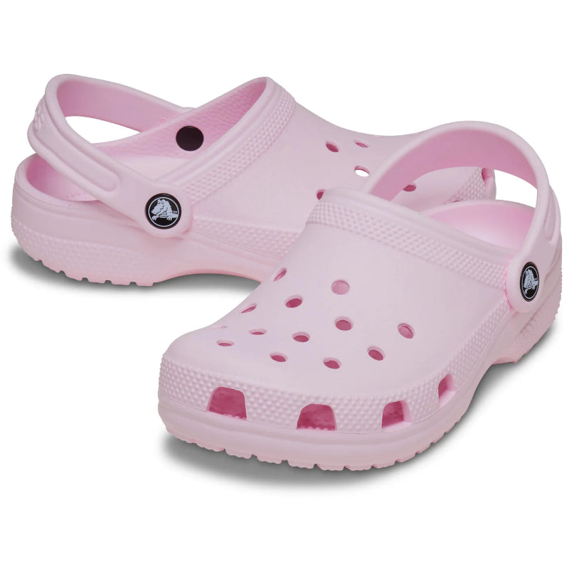 Pink clogs with a white background