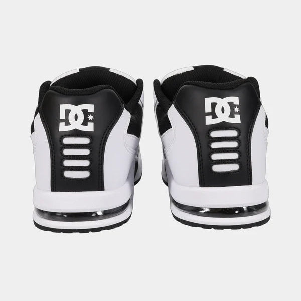 Black and white sneakers with a logo on a white background