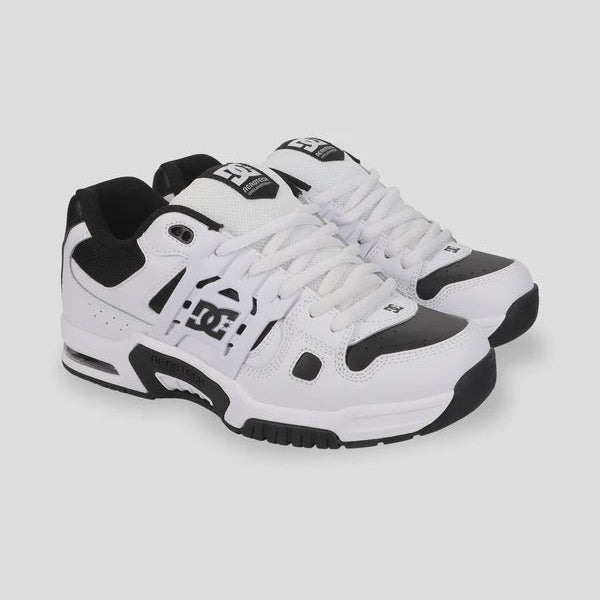 White and black sneakers with brand logo on a white background