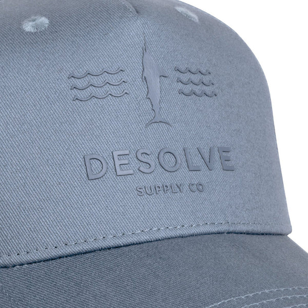 Gray cap with 'DEsolve Supply Co' logo and fish design on a white background