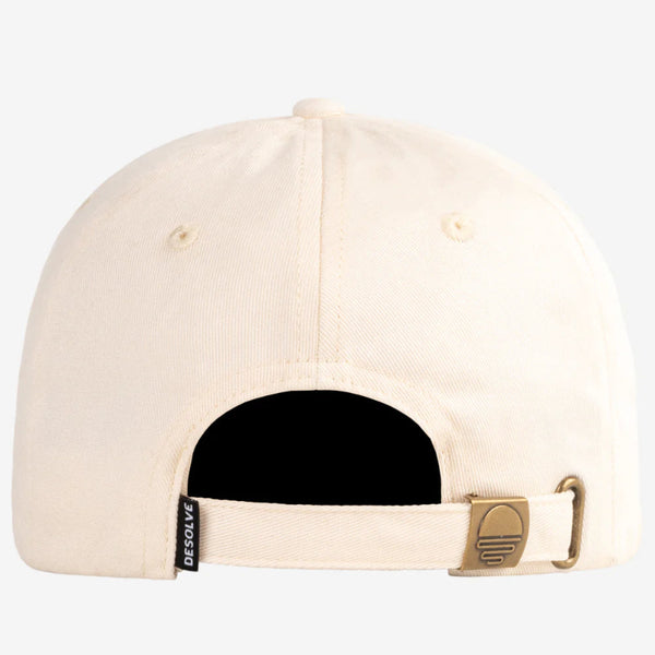 Beige cap with a black strap and visible brand logo on a white background