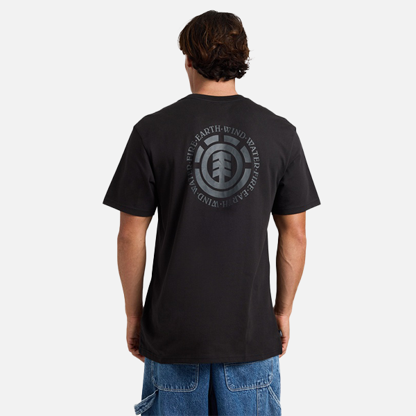 Person wearing a black t-shirt with a logo on the back, standing against a white background