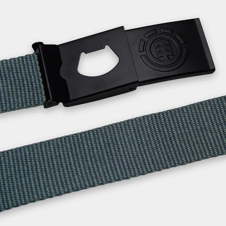 A close-up of a woven belt strap in a muted blue-gray color with a black buckle featuring a bottle opener cutout and an embossed circular logo.