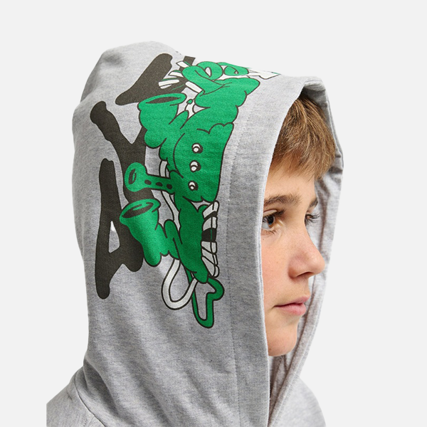 Person wearing a gray hoodie with a green and black graphic design on a white background