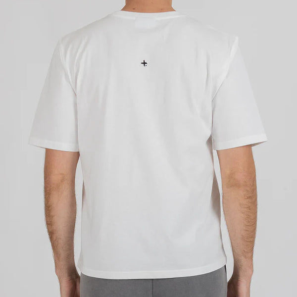 Person wearing a white t-shirt with a black logo on the back against a plain background