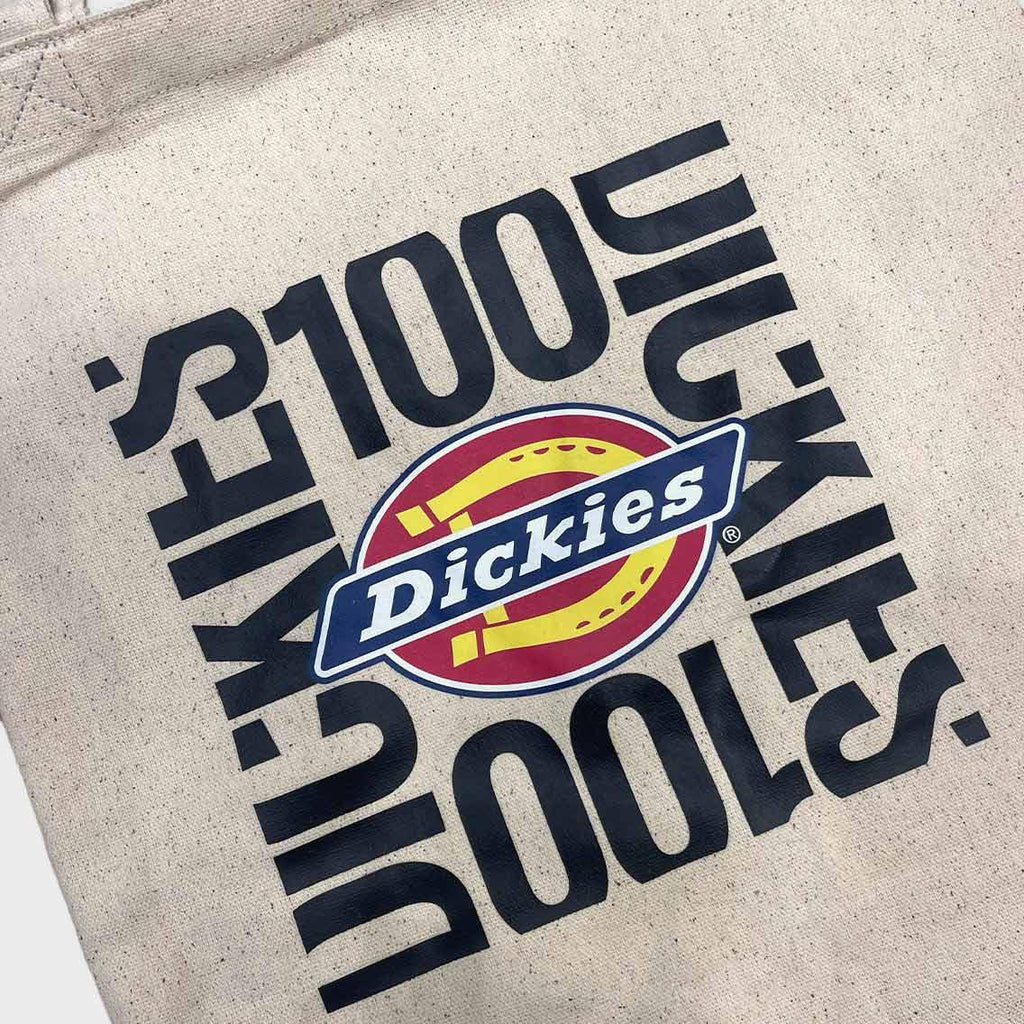 Tote bag with Dickies logo and text on a beige background