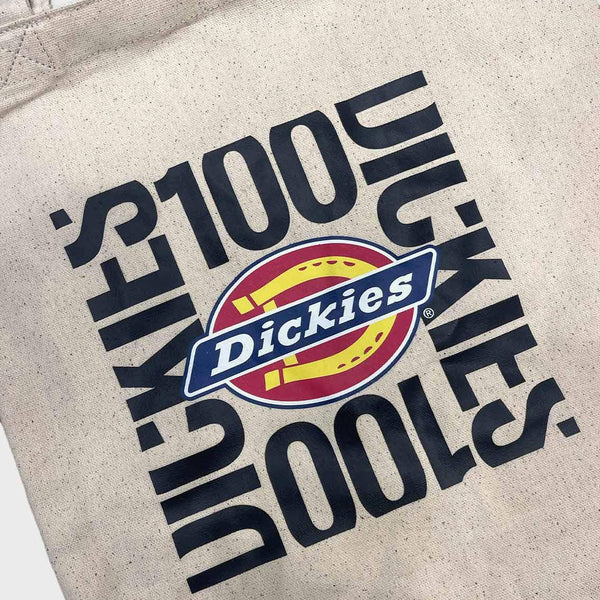 Tote bag with Dickies logo and text on a beige background