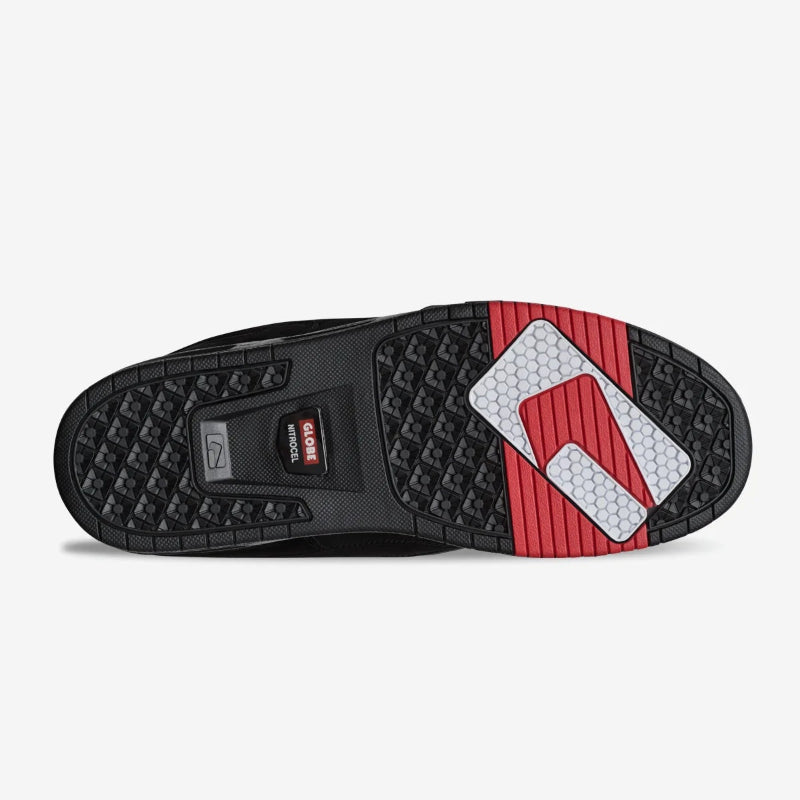 Close-up of a shoe sole with a red and white logo on a light gray background