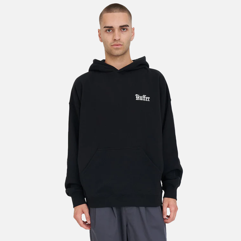 Man wearing a black hoodie with 'Huffer' logo on a white background